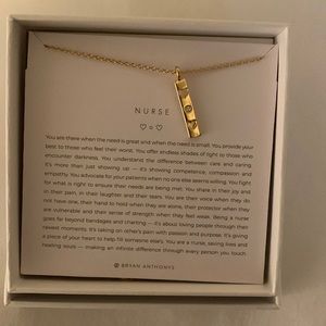 Bryan Anthonys gold nurse necklace